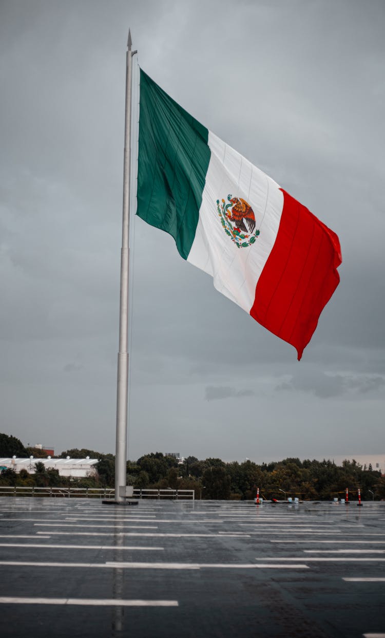 Monumental Mexican Flag Waving On A Rainy Day In Puebla