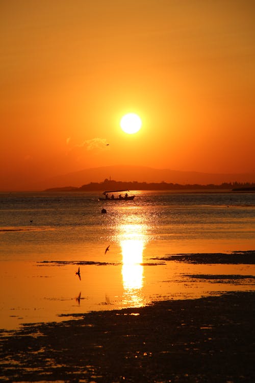 Sun on Yellow Sky over Sea Shore at Sunset