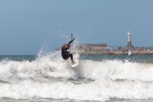 Man Surfing on Sea Waves