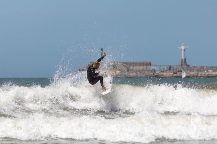 Man Surfing On Sea Waves