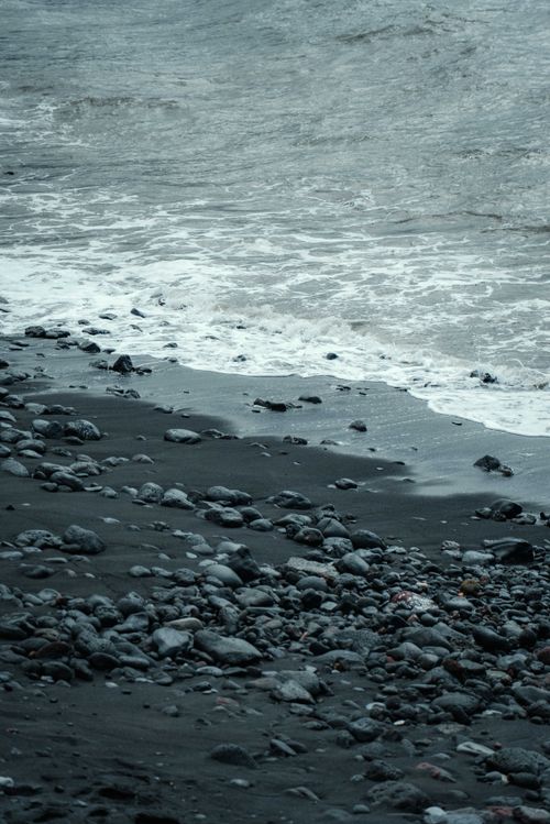 Free Explore the rugged black sand beach and crashing waves in Puerto de la Cruz, Spain. Stock Photo