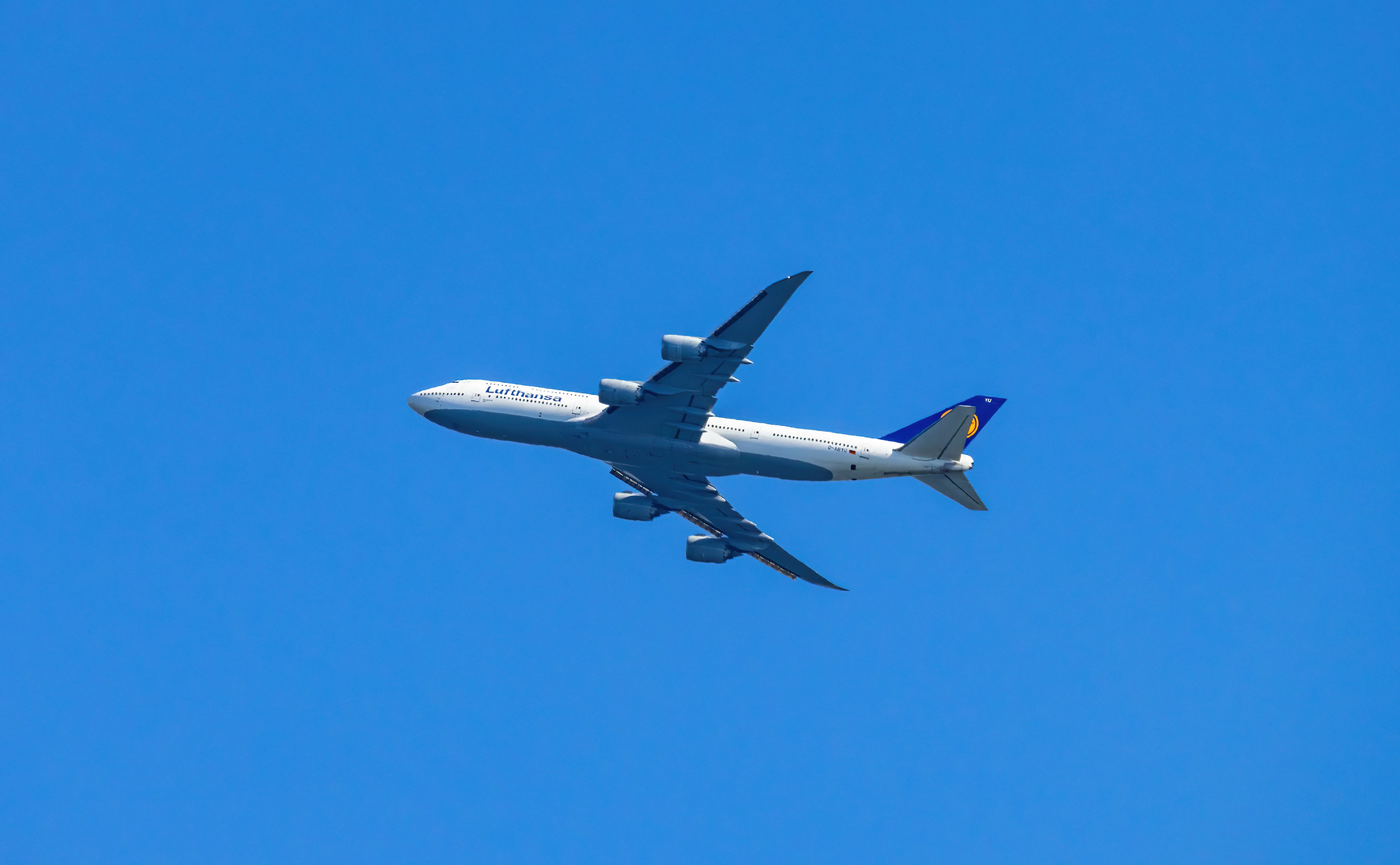 An Airplane in the Blue Sky · Free Stock Photo