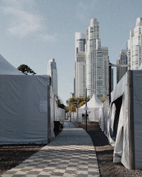View of modern high-rise buildings in Buenos Aires from a tented walkway area on a sunny day.