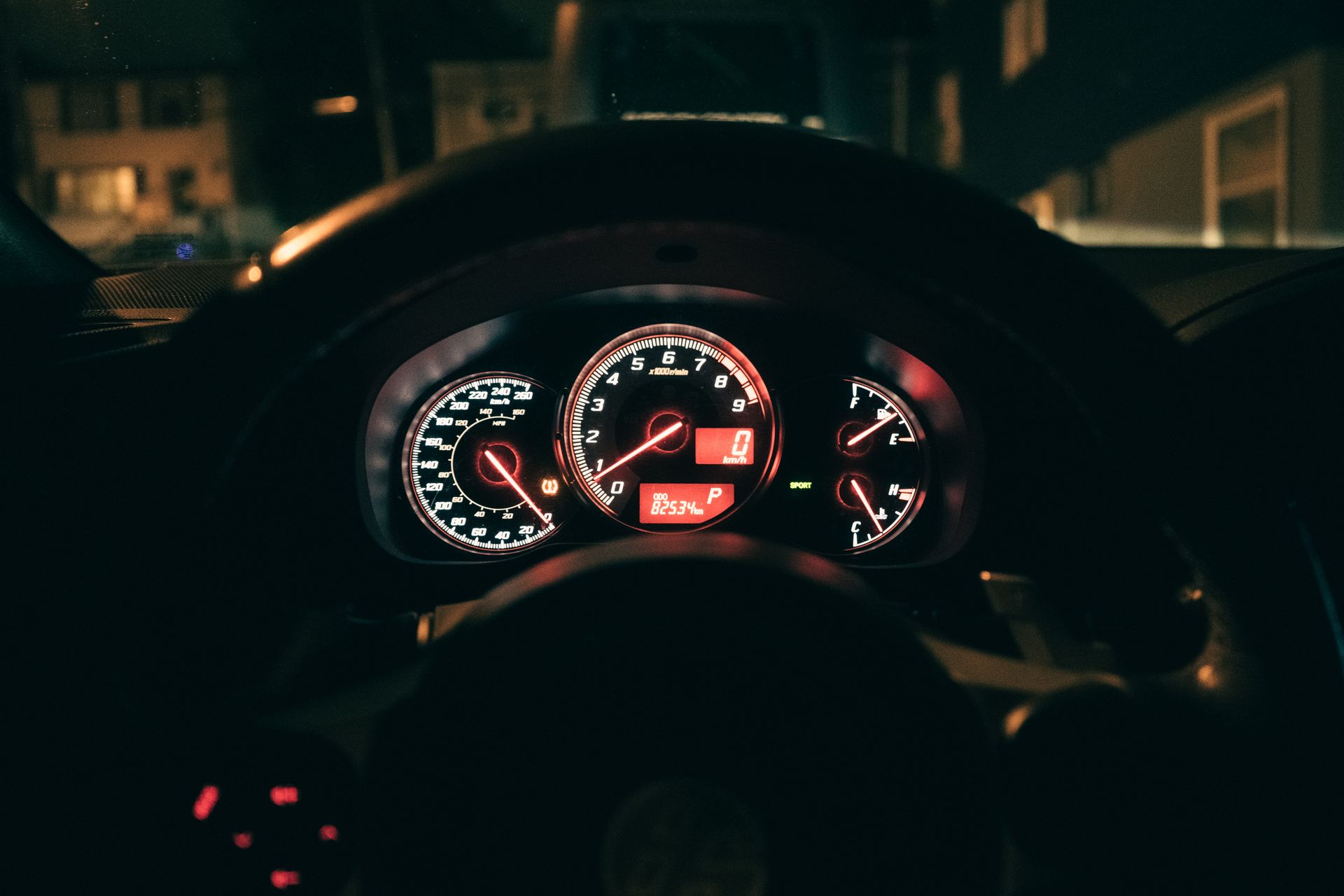 Illuminated car speedometer and rev counter at night