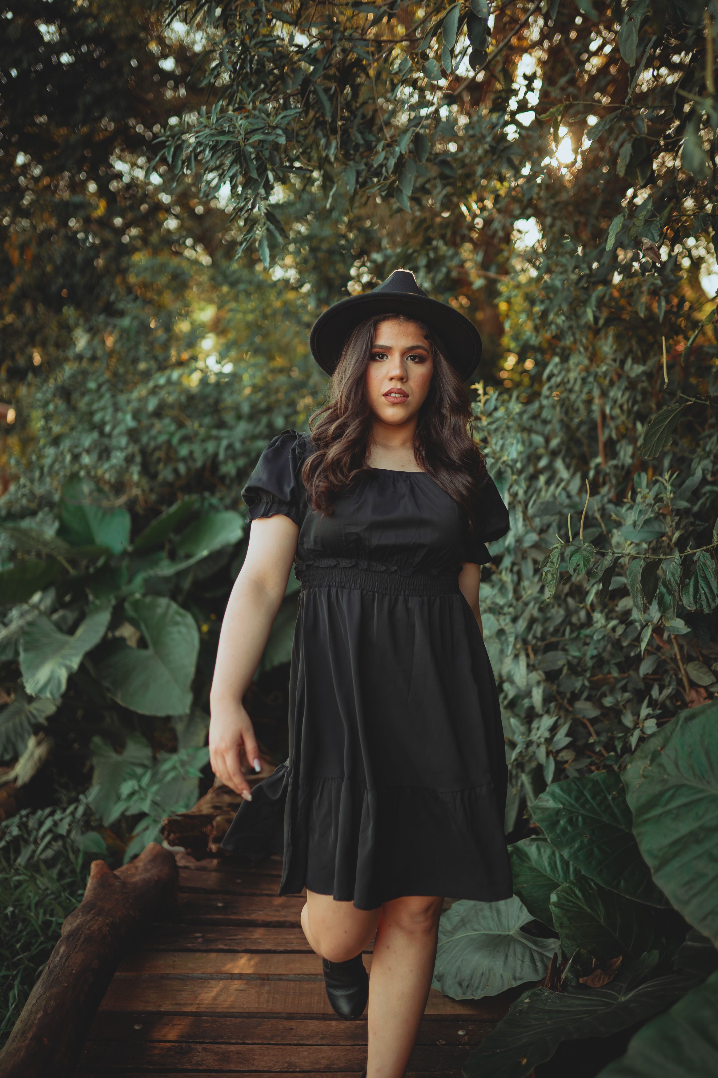 A Woman in a Black Dress Walking · Free Stock Photo