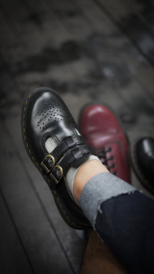 Person Wearing Black Leather Shoe