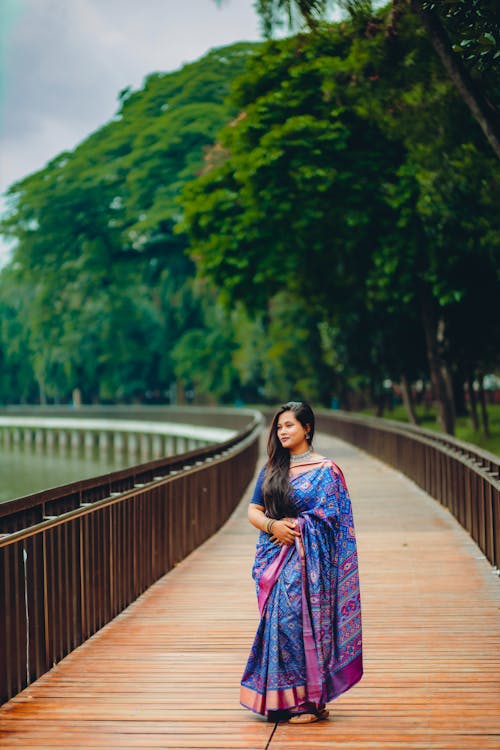 A Woman Standing on the Bridge