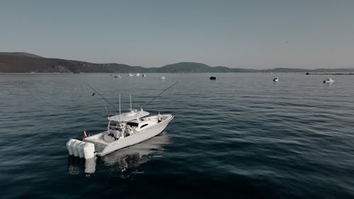 White Boat on Body of Water