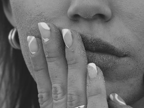Grayscale Photography of Woman with Hand on Face