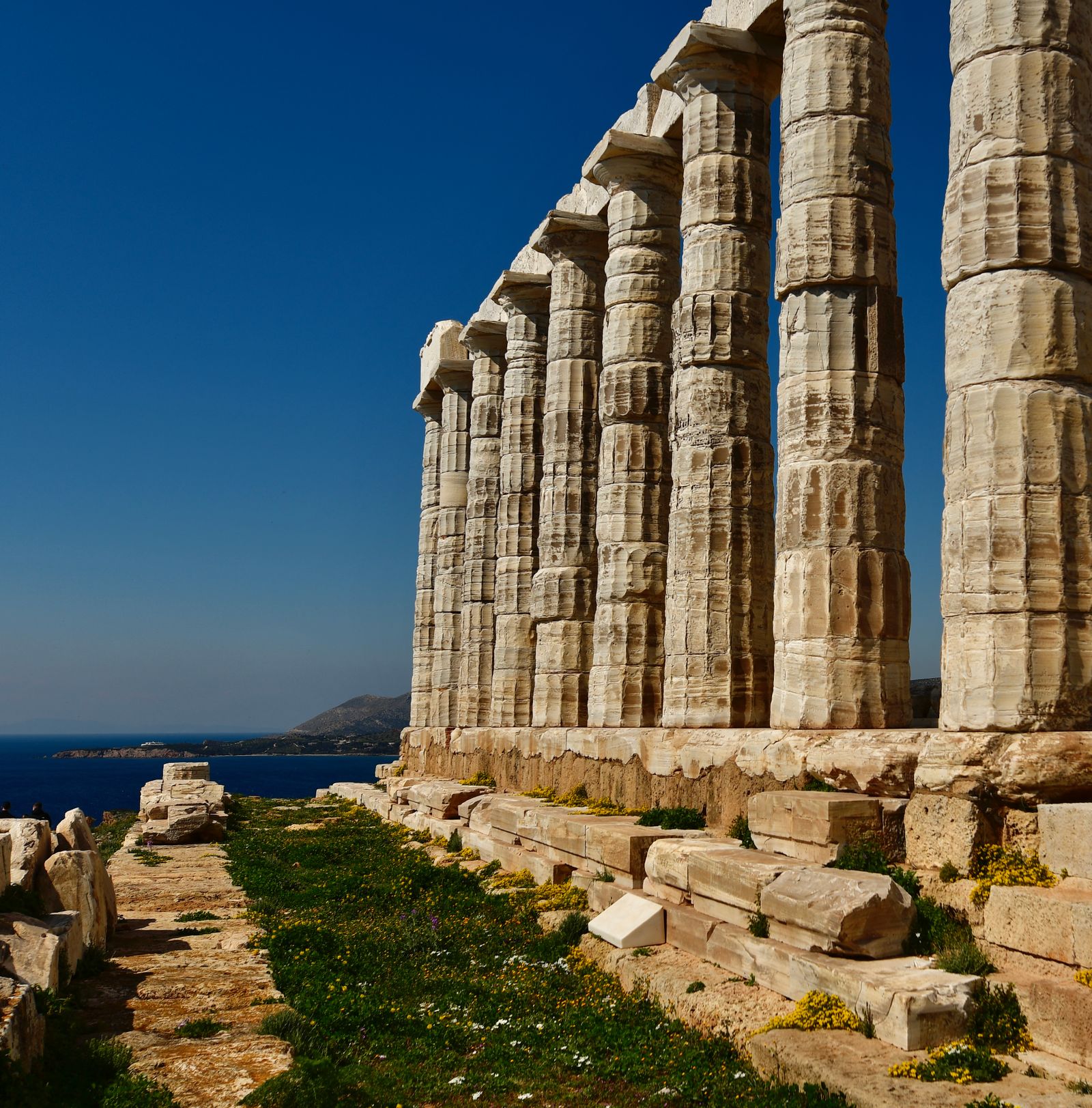 The ancient Temple of Poseidon above the Aegean Sea in Greece with no people in the frame, a real photo chosen for the Percy Jackson Netflix story