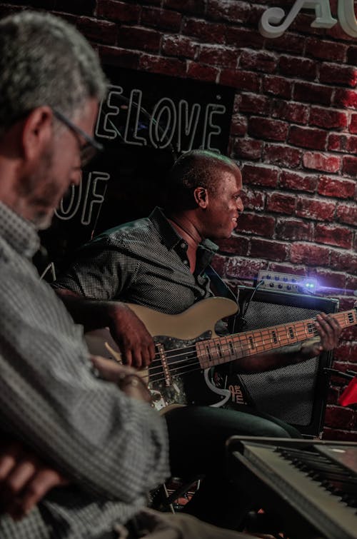 Men Playing Musical Instruments