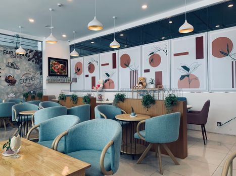 A modern café interior featuring stylish decor and cozy seating for a relaxing atmosphere.