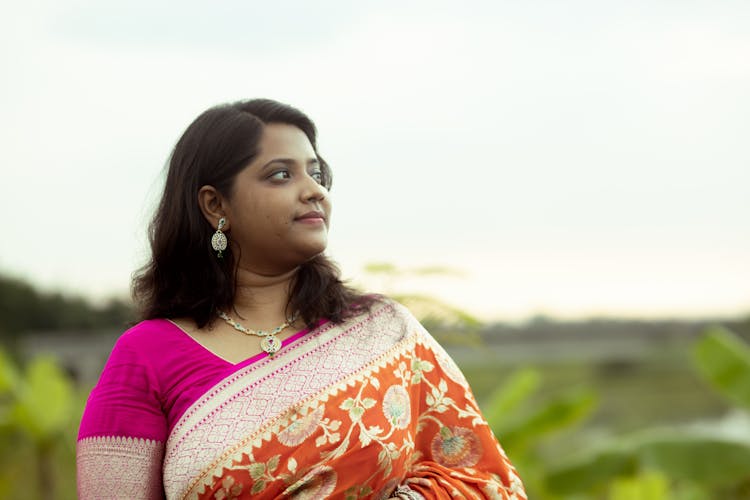 A Woman In Floral Saree 