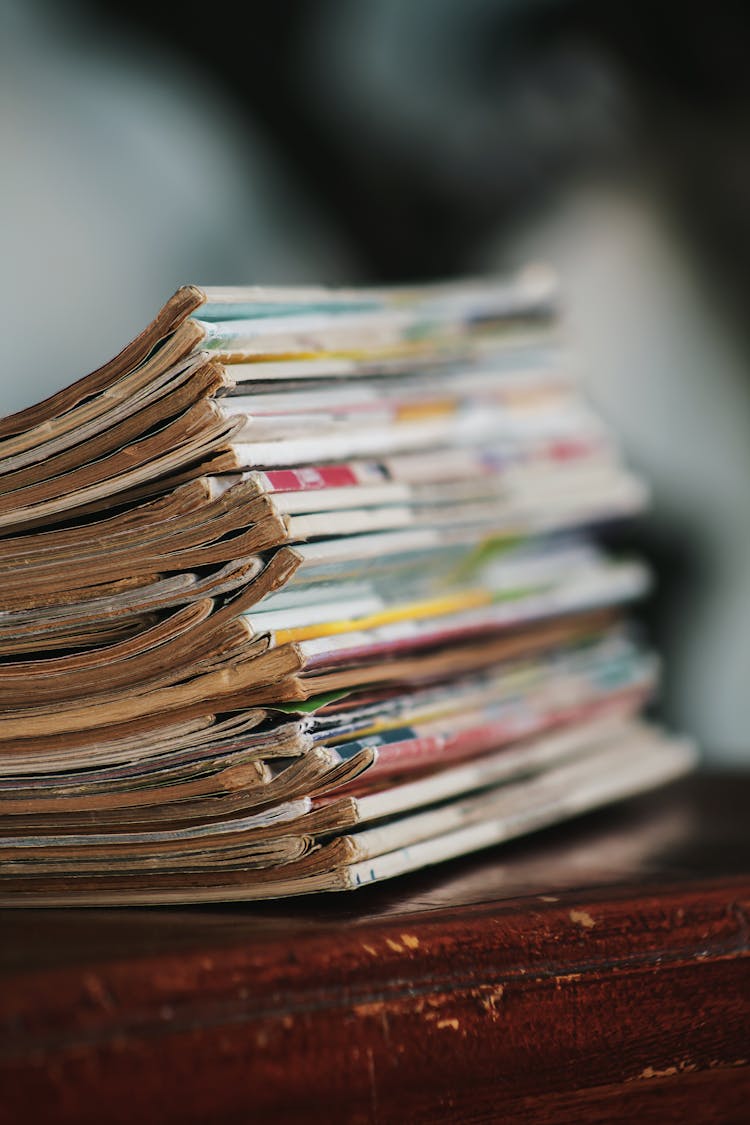 Stack Of Magazines On Brown Wooden Table