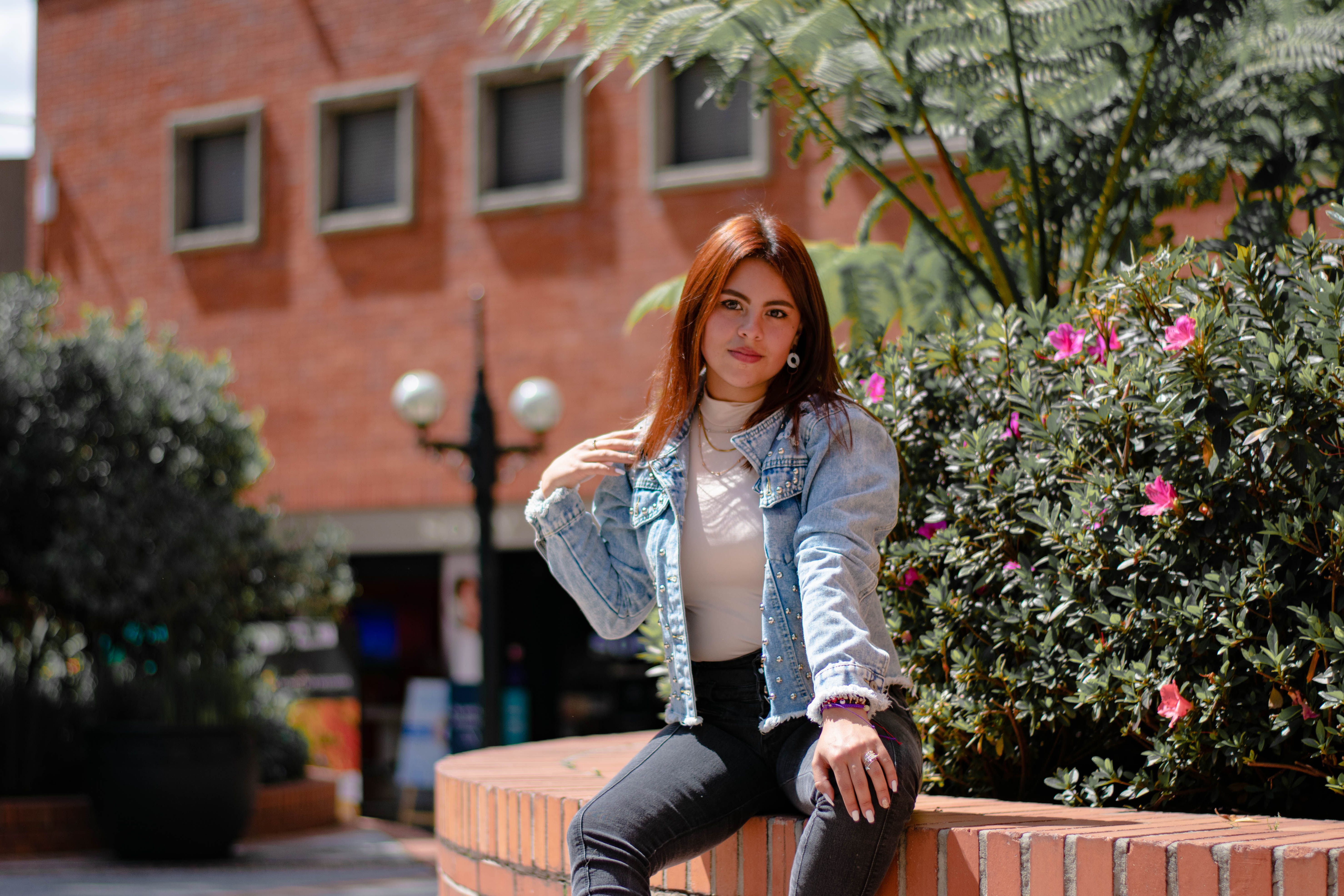 A Woman in Denim Jacket Sitting on the Bench · Free Stock Photo