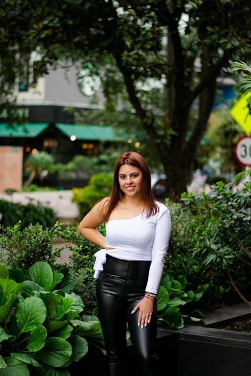 A Beautiful Woman in Black Leather Pants Smiling