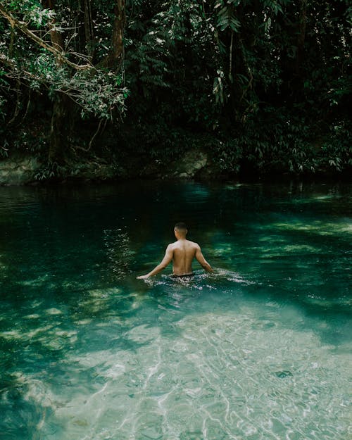 Shirtless Man in the Water