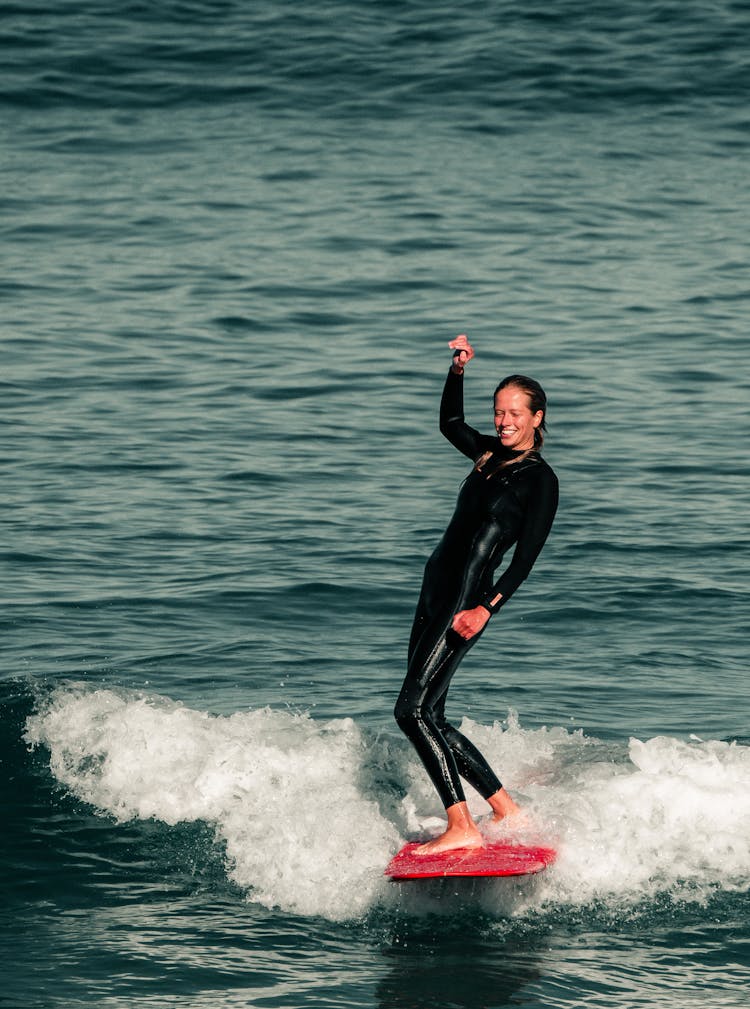 Photo Of A Woman Surfing