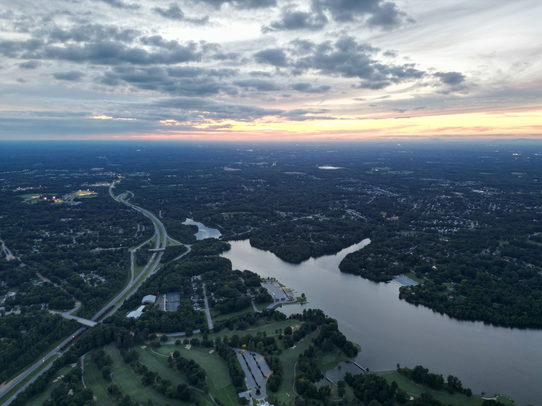 Discover the serene landscape of High Point, NC, captured from above at sunrise.