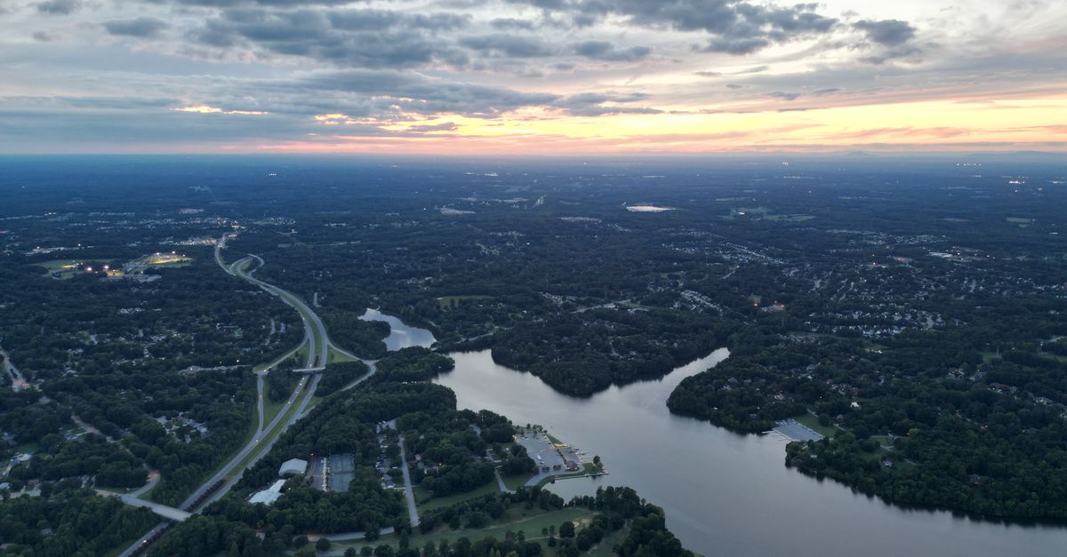 Discover the serene landscape of High Point, NC, captured from above at sunrise.