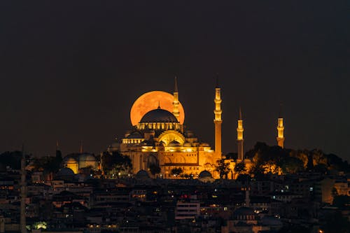 Large Moon Behind Illuminated Suleymaniye Mosque