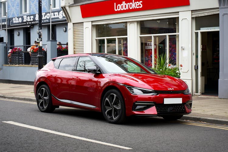 A Red Electric Car Parked On The Street