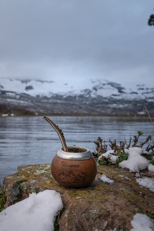 Mate Gourd Container on Top of a Brown Rock