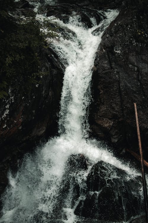 Water Falls Between Rocky Mountain