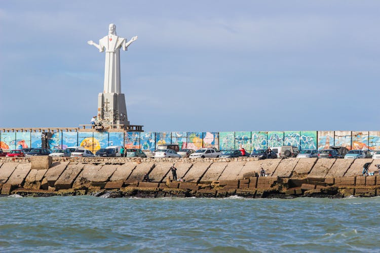 Breakwater Near A Big Statue