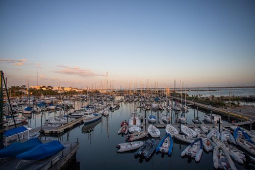 Free Idyllic sunset over Marina in Mar del Plata, Argentina, with boats docked peacefully. Stock Photo
