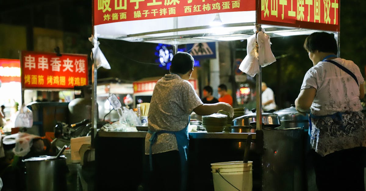 Person Cooking on Food Stall