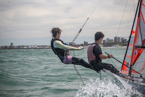 Two Men Windsurfing