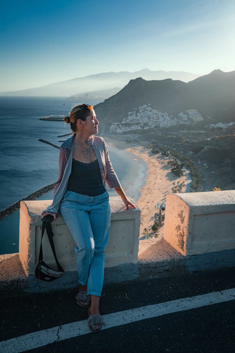 Tourist In Seaside At Sunset