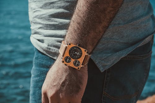 Person Wearing Brown Leather Strap Wristwatch