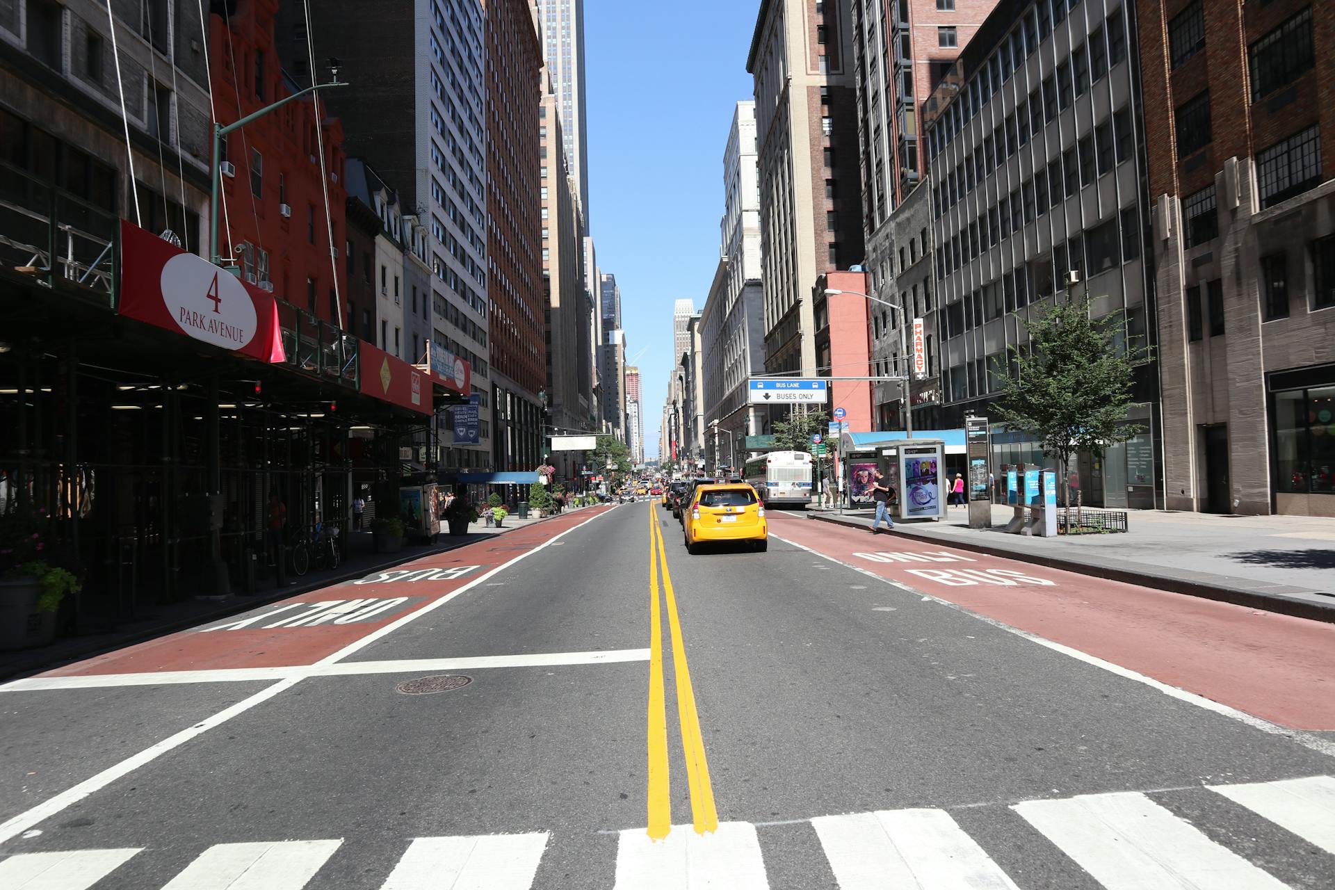 A vibrant street view of Park Avenue in New York City showcasing urban life and traffic.