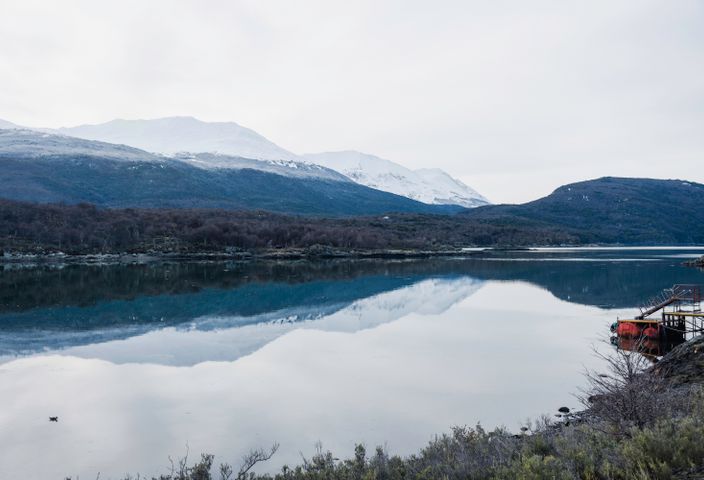 Peaceful mountain landscape with water reflection in Ushuaia, Argentina.