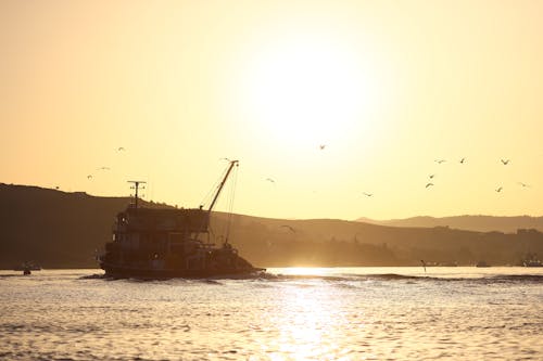 Boat on the Ocean during Sunset