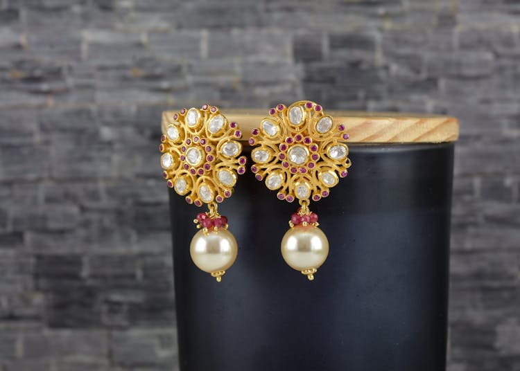 Close-up Of Gold Earrings With Pearls 