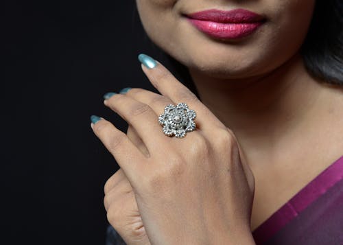 Close-Up Shot of a Woman Wearing a Silver Ring