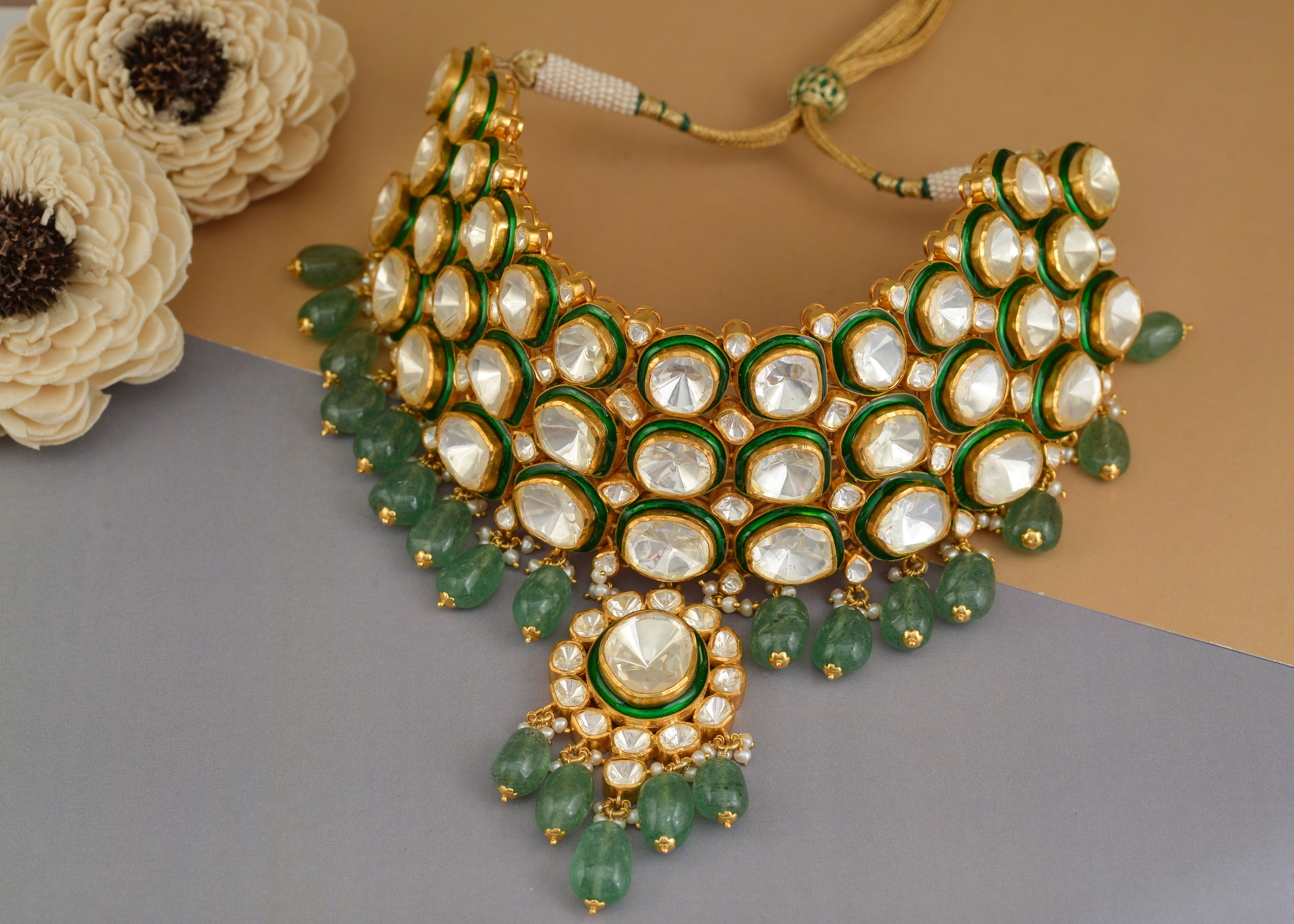 Intricate Indian Polki necklace adorned with emerald stones