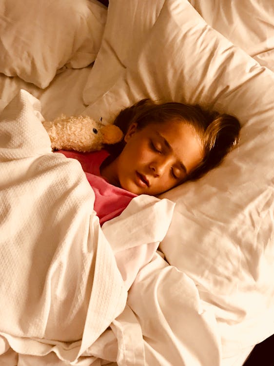 Free Girl Sleeping on Bed Stock Photo