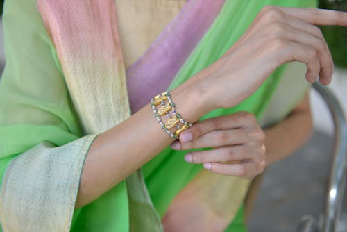 Close-Up Shot of a Person Wearing a Beaded Bracelet