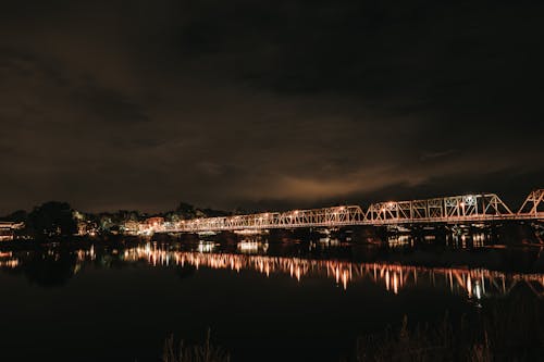 Photo of Steel Bridge Under Cloudy Sky