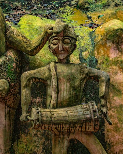 Free Intricate ancient stone sculptures surrounded by greenery in Osun, Nigeria's sacred grove. Stock Photo