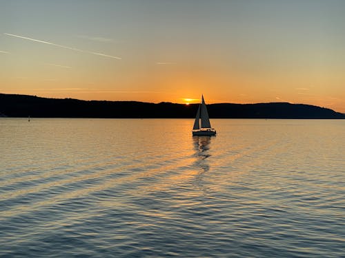 Sailboat on the Sea during Sunset