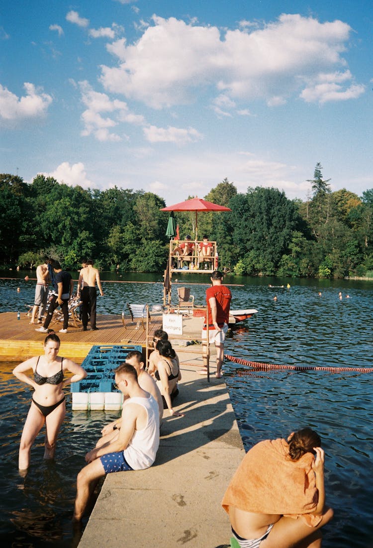 People Having Fun In The Lake