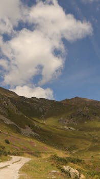 Explore a beautiful mountain landscape with clear skies, perfect for hiking enthusiasts.