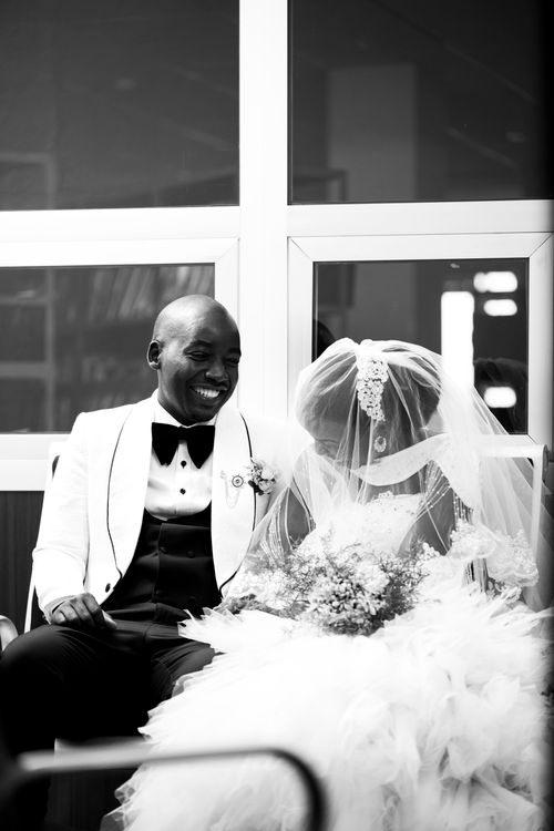 Free Captivating black and white portrait of an African American couple on their wedding day, embracing love. Stock Photo