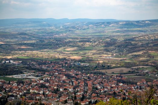 Scenic aerial view over a quaint town surrounded by sprawling countryside.