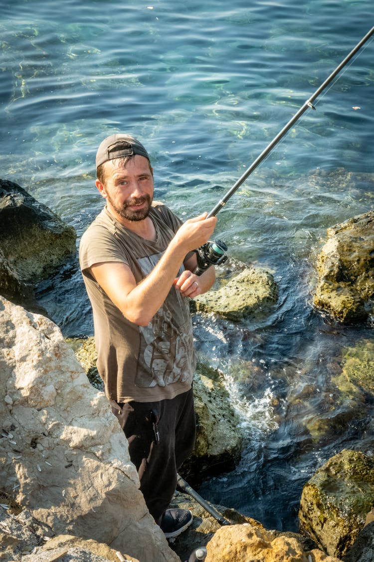 Man Holding A Fishing Rod